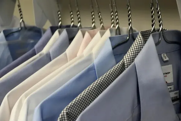 Pressed shirts and jackets on hangers