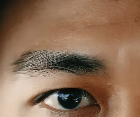 Close-up of a man's eyebrow